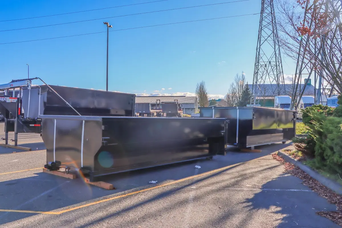 Roll-off dumpster ready for waste disposal at job site for Concrete Dumpster Rental in Jamestown